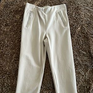 Have: Light cream leggings W/ silver faux zipper pockets